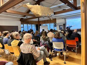 Prof. Kyle Armour presenting to a roomful of attendees