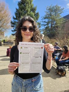 Author holding copy of flyer