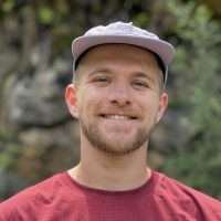 A headshot photo of Jacob smiling