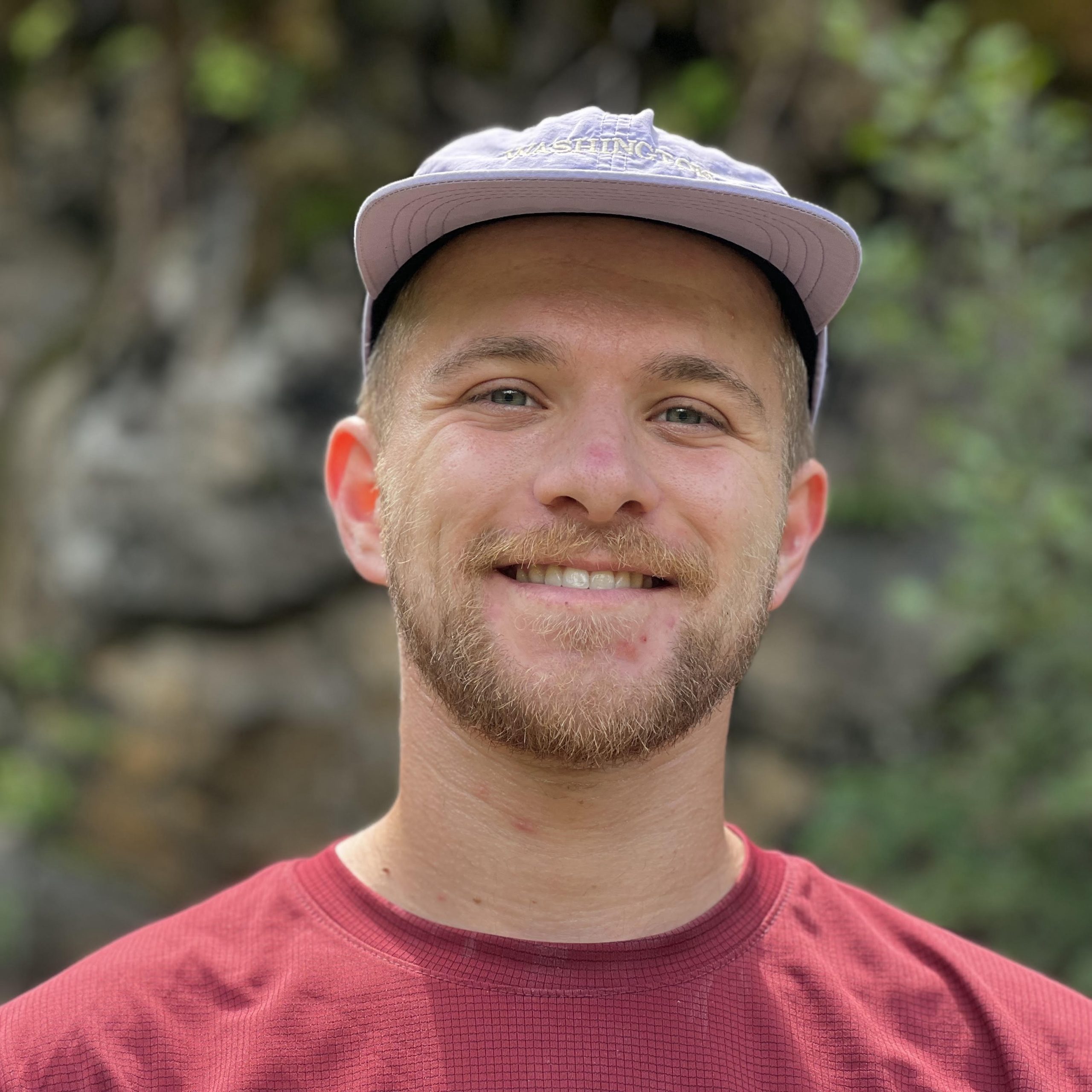 A headshot photo of Jacob smiling