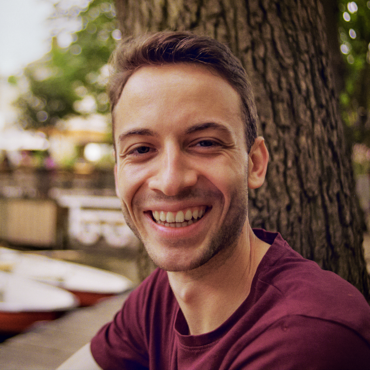 Headshot photo of Dominik smiling