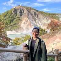 amy liu picture in front of beautiful landscape