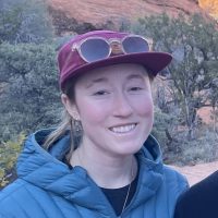 Sydney headshot with hat and sunglasses outside