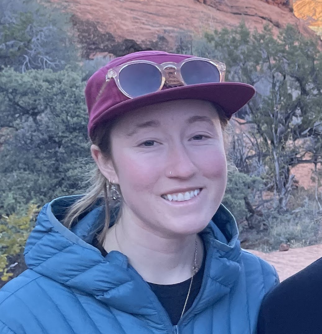 Sydney headshot with hat and sunglasses outside