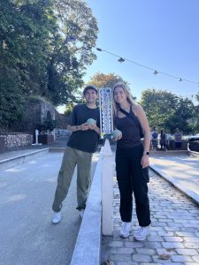 Elise and Jonas smiling for a photo after winning in bocce ball.