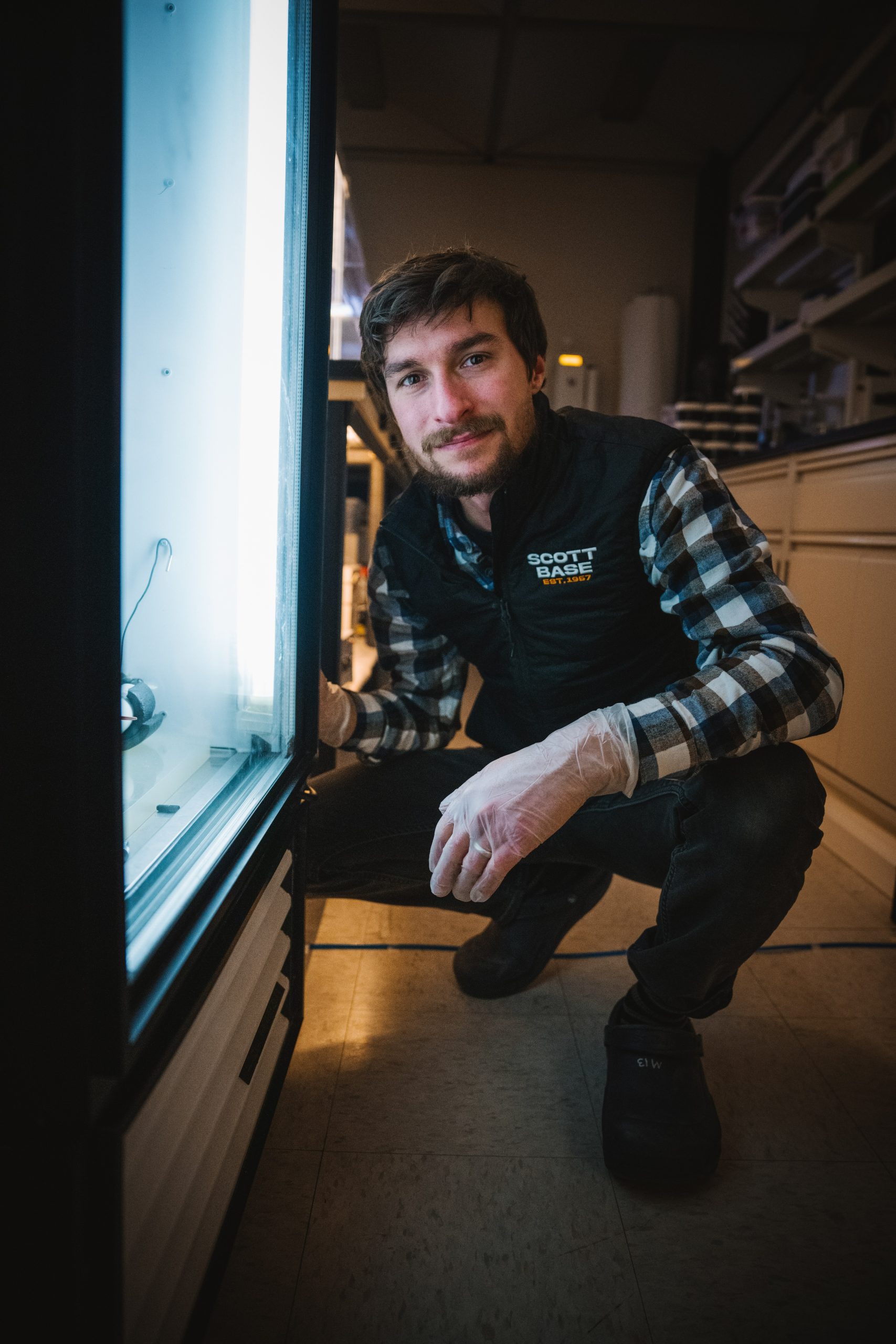 Jacob Chalif profile photo posed squatting in a lab